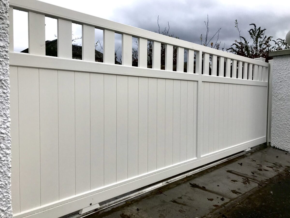 AES (SCOTLAND) LTD newly installed aluminium automatic sliding driveway gate with matching pedestrian gate in RAL9010.