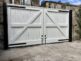 AES (SCOTLAND) LTD recently installed solid white wooden driveway gates in Edinburgh